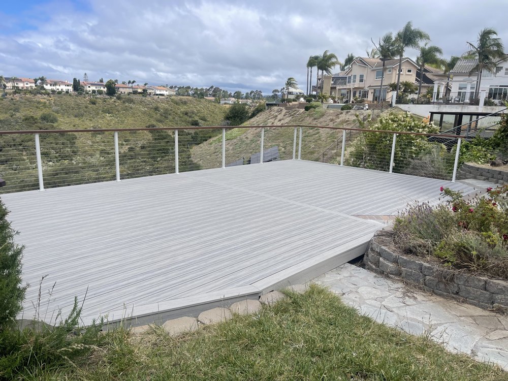 Multi-level composite deck with cable railing on a San Diego hillside canyon lot