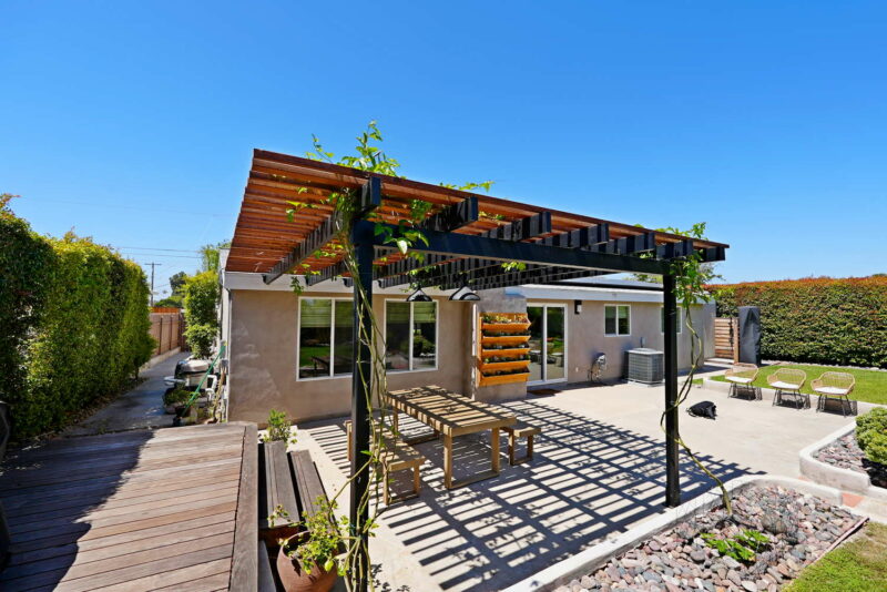 Deck with a pergola and patio in San Diego
